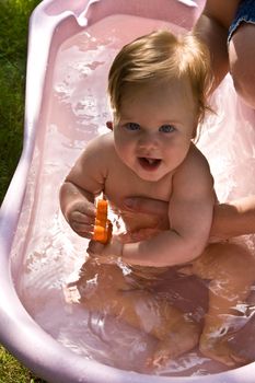 baby series: baby take a bath on the open air