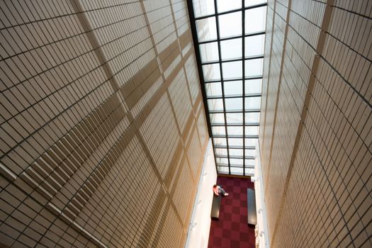 it is a modern building in hong kong and some people reading