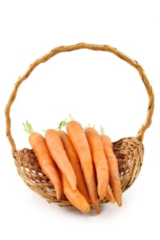 fresh carrots in a wicker basket