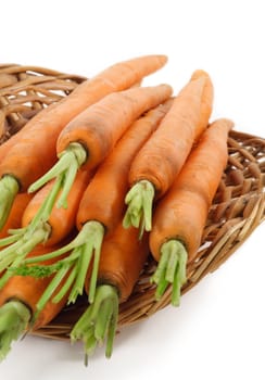 fresh carrots in a wicker basket