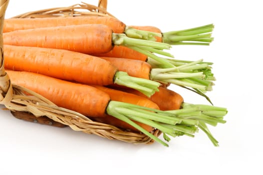 fresh carrots in a wicker basket