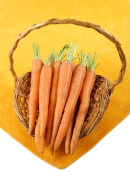 fresh carrots in a wicker basket