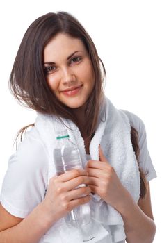 Portrait of a young woman with towel and bottle of water over white