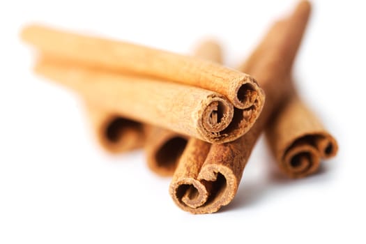 Cinnamon sticks on white. Close up view.