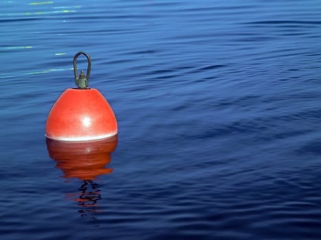 Buoy on a blue water