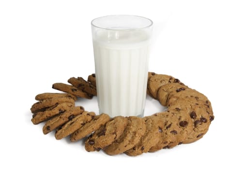 glass of milk and chocolate chip cookies on white background