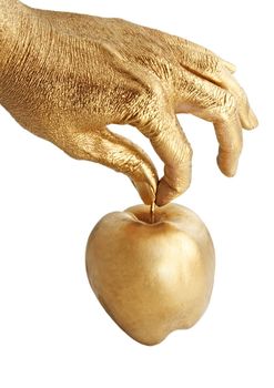 gold hand holding and apple