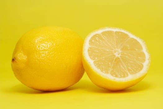 fresh lemon on yellow background