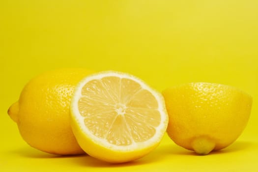 fresh lemon on yellow background