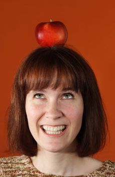 woman with an apple on top of her head