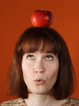 woman with an apple on top of her head