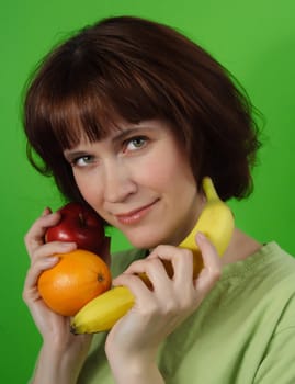 healthy woman holding some fresh fruit