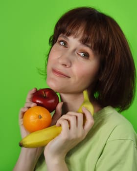 healthy woman holding some fresh fruit