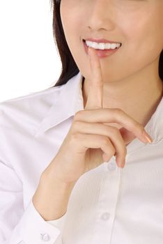 Silent sign with finger on lips of business woman on white background.