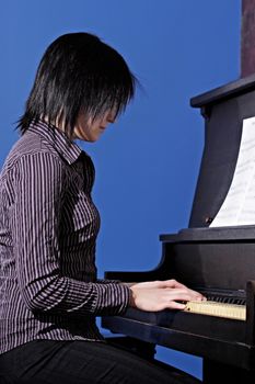 young woman playing piano