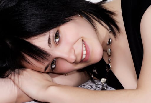 young smiling woman with short black hair