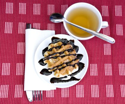 chocolate waffle and herbal tea for a sweet indulgent breakfast