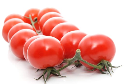 cluster of small tomatoes isolated on white