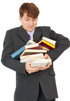 The man - a student hold heap of books and textbooks