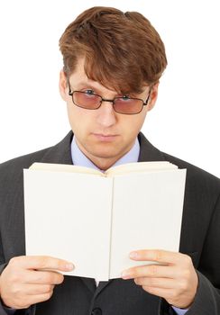 A serious man in glasses gets acquainted with the contents of the book
