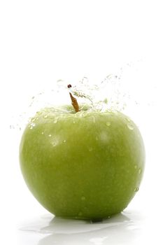 green apple with waterdrops, white background