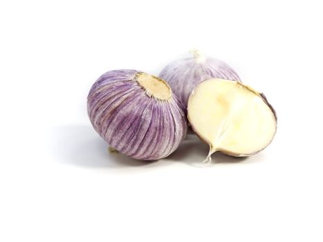 close-up of fresh purple garlic  isolated on white background