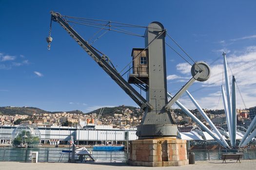  the port of Genoa with on ald crane on foreground