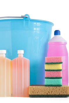 Colored plastic detergent bottles with bucket and sponges isolated on white background with clipping path