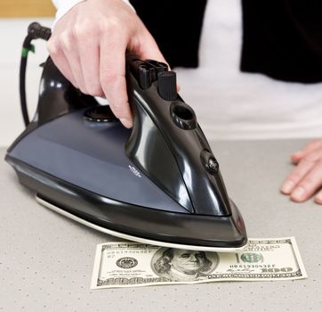 Ironing a dollar bank note