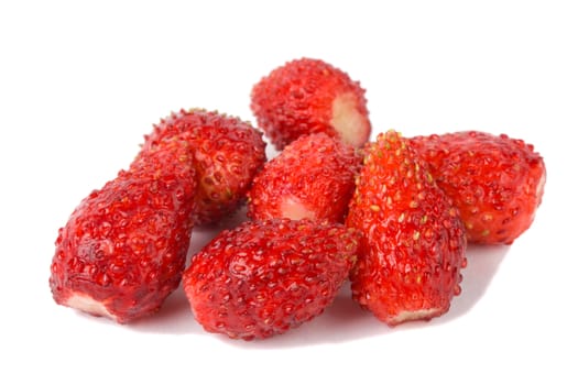 close-up heap of wild strawberries, isolated on white