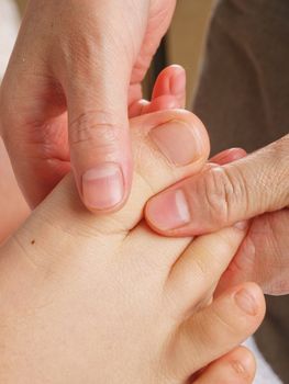 Female hands giving zone therapy