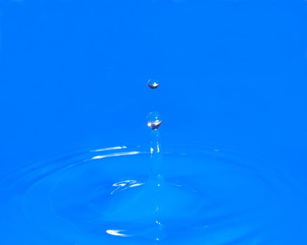 A waterdrop has been photographed on it's upward return.