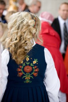 A young norwegian girl in a traditional costume