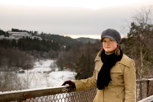 A young woman outside in winter with freckles