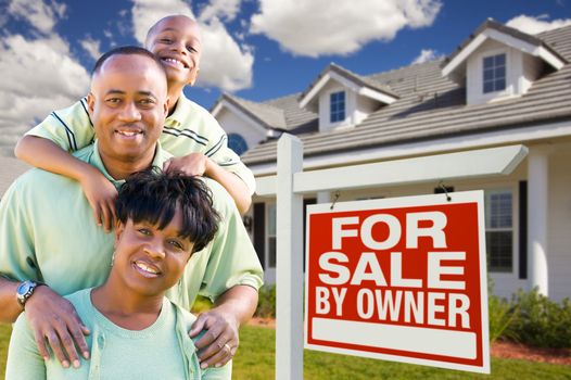 Attractive, Happy African American Family with For Sale By Owner Sign in Front of House.