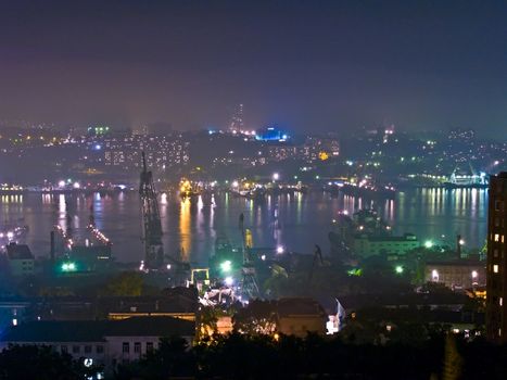 View from above on a night seaport town