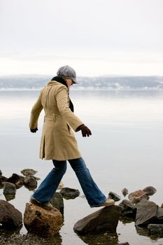 A woman standing near the ocean