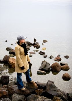 A woman standing near the ocean