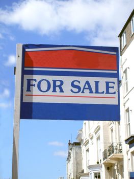 Close up portrait of for sale sign outside house, copy space.