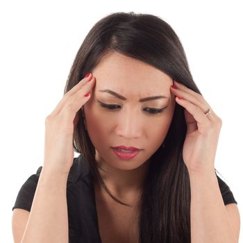 Worried attractive young asian woman with headache, head in hands