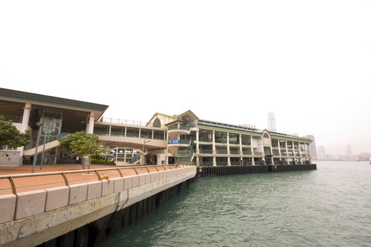 it is a wide shot of ferry station in hong kong