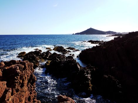 Mediterranean sea and red rocks of Esterel massif in south of France