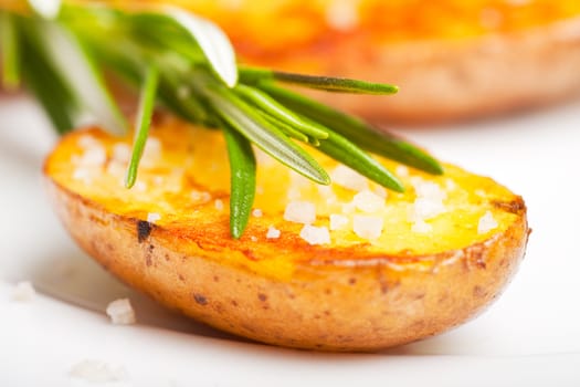 fried potato with a rosemary leaf