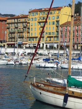 Boats and colored buildings of Nice port, France