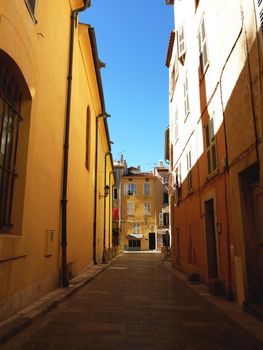 Colored and narrow street in Saint-Tropez, south of France, by beautiful weather