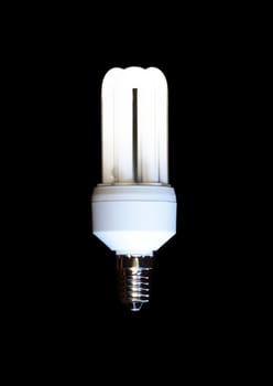 Energy saving compact fluorescent lightbulb isolated on black background 