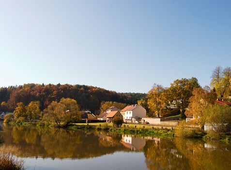 A picturesque fall reflection of a quaint european village in Czech