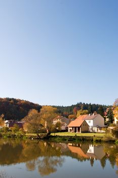 A picturesque fall reflection of a quaint european village