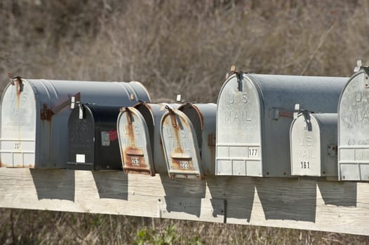 row of old rural mail box.  USA