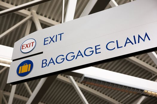 Baggage claim and exit sign in an airport